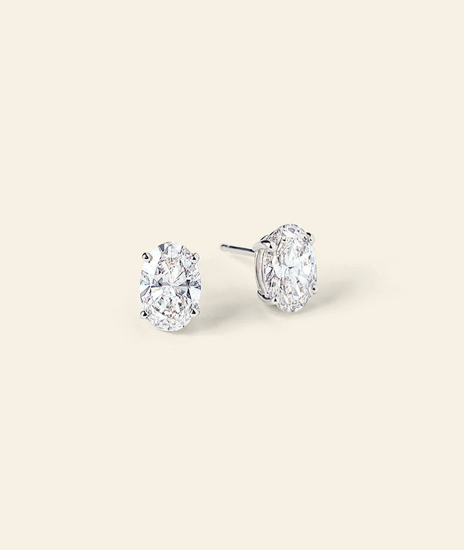 White gold, oval diamond stud earrings.