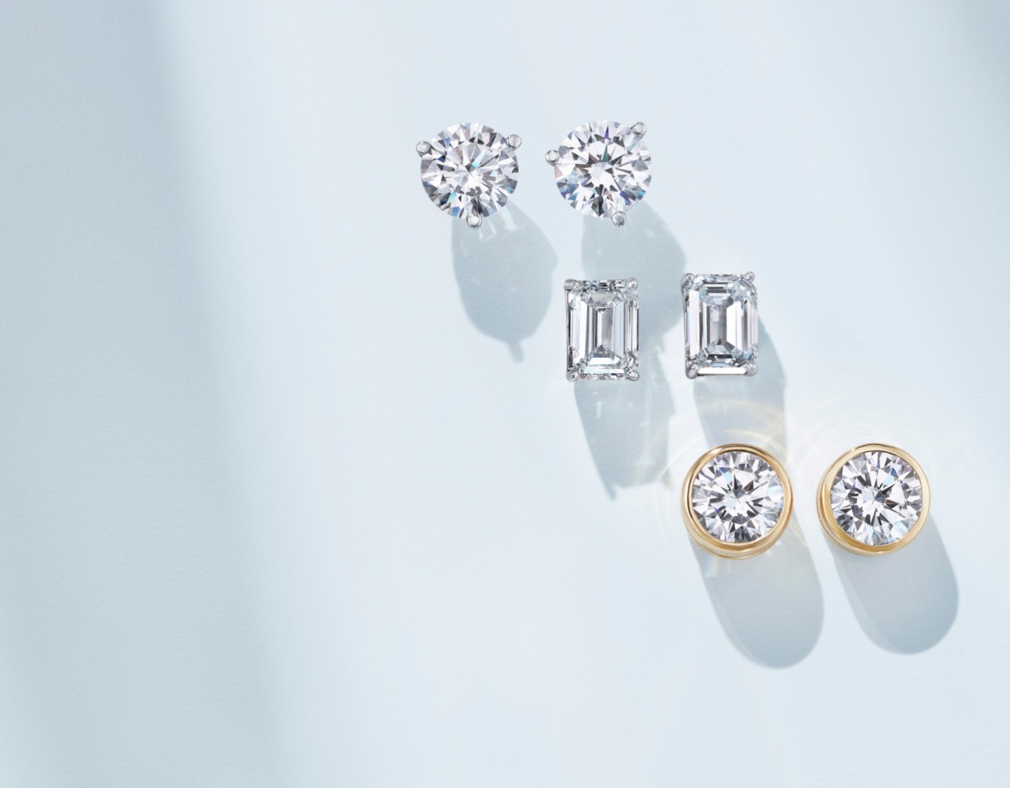 Assortment of diamond earrings in a variety of settings