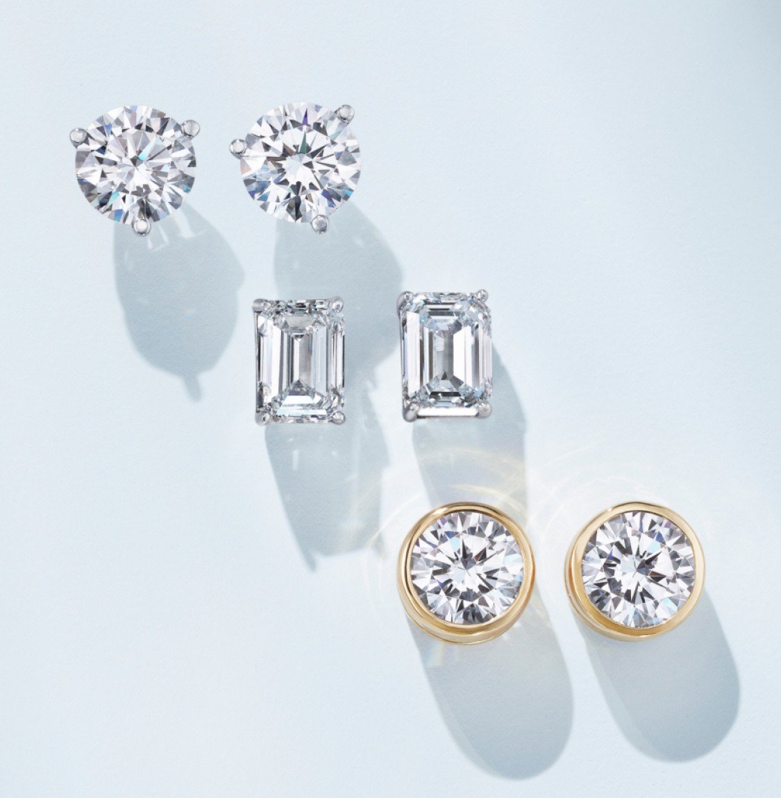 Assortment of diamond earrings in a variety of settings