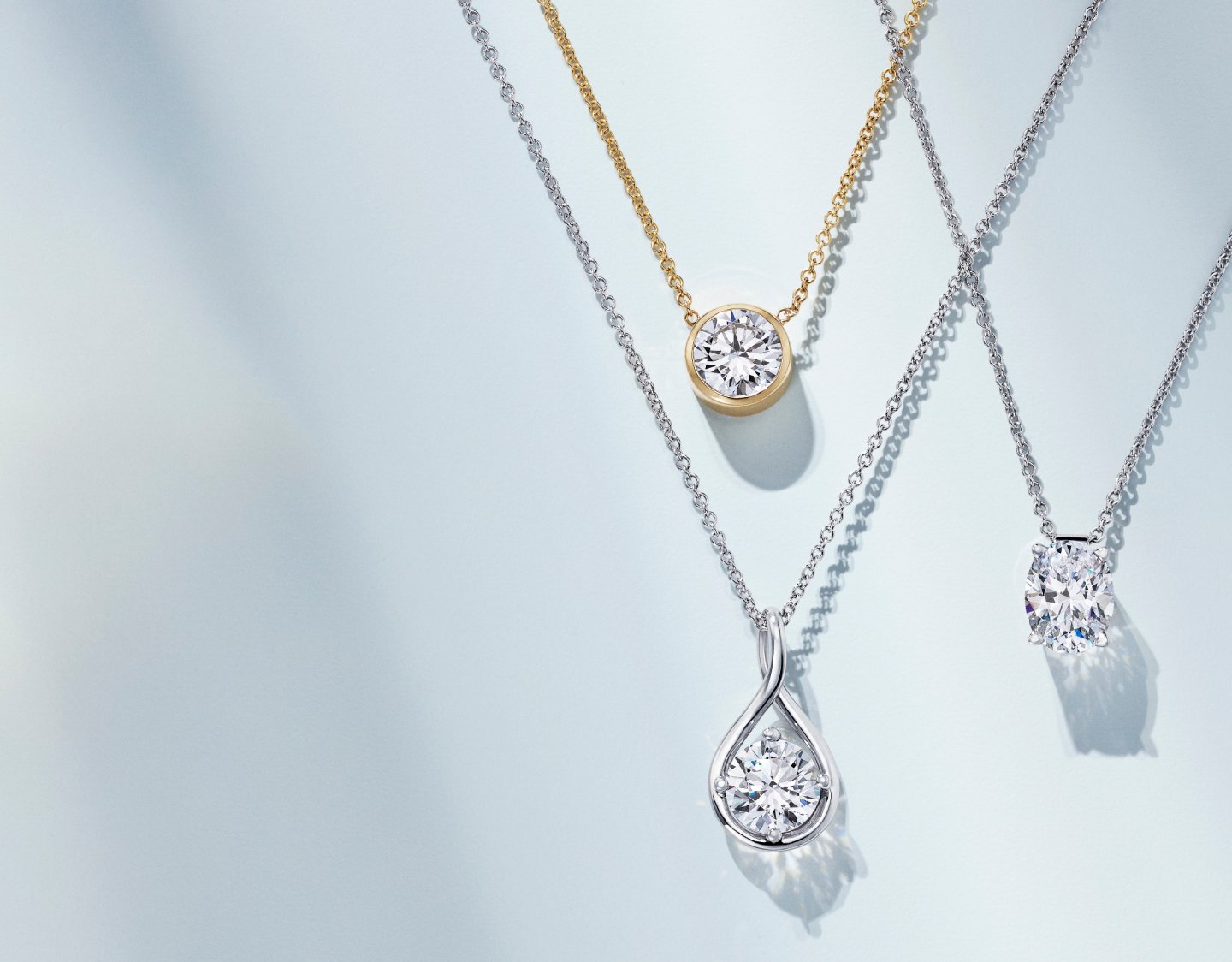 Assortment of gold diamond necklaces.