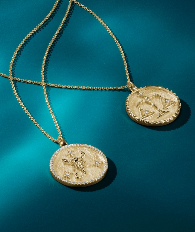 Gold zodiac necklaces.