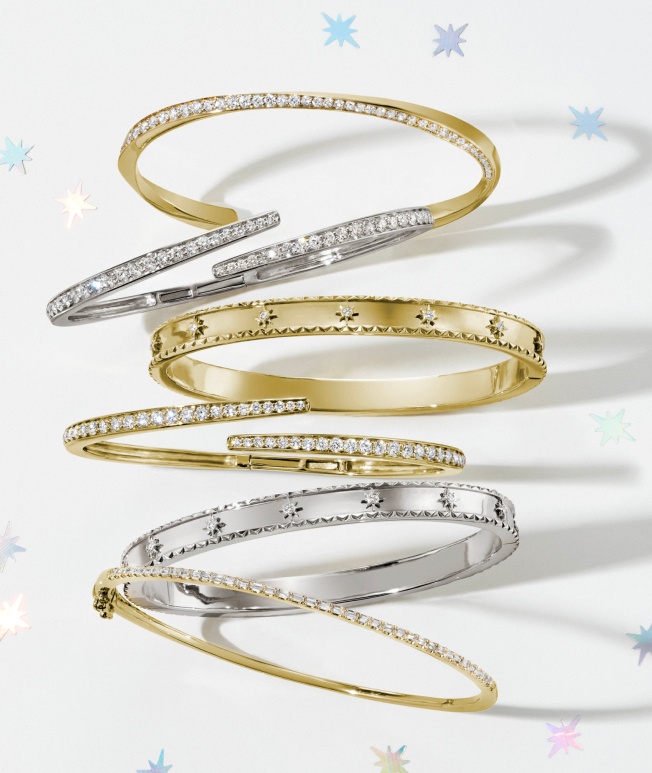 Variety of gold diamond bangles.