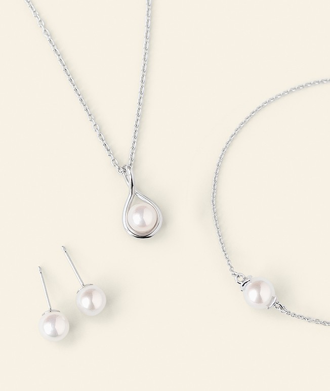 Pearl jewelry featuring pearl earrings, necklace, and bracelet