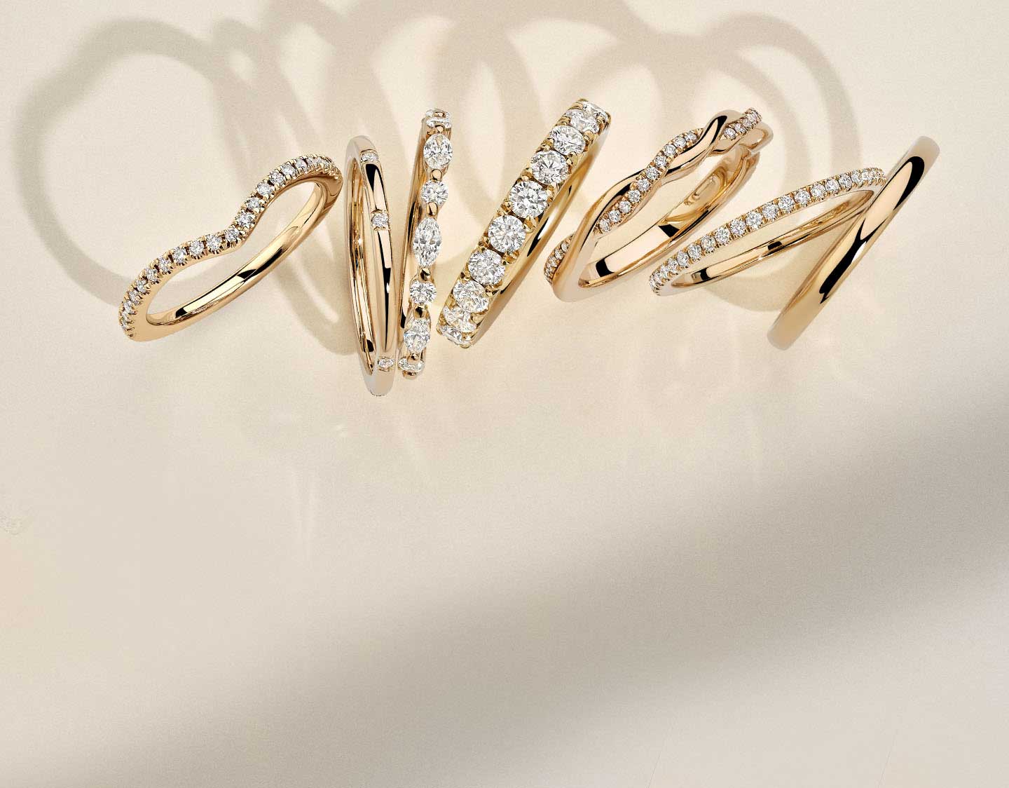 Assortment of gold diamond stacking rings.
