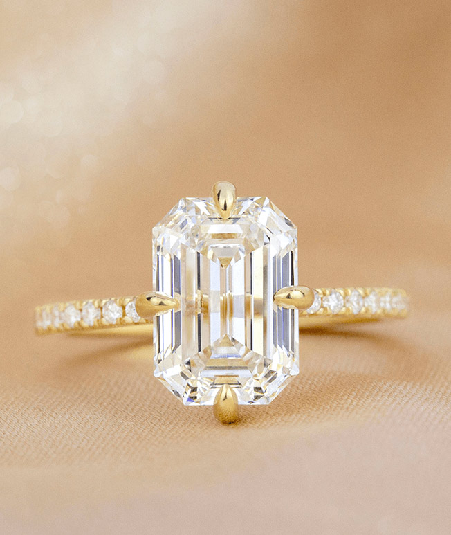Emerald shaped diamond engagement ring