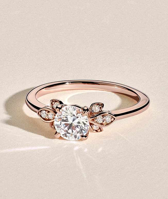 Rose gold round shaped accented diamond ring