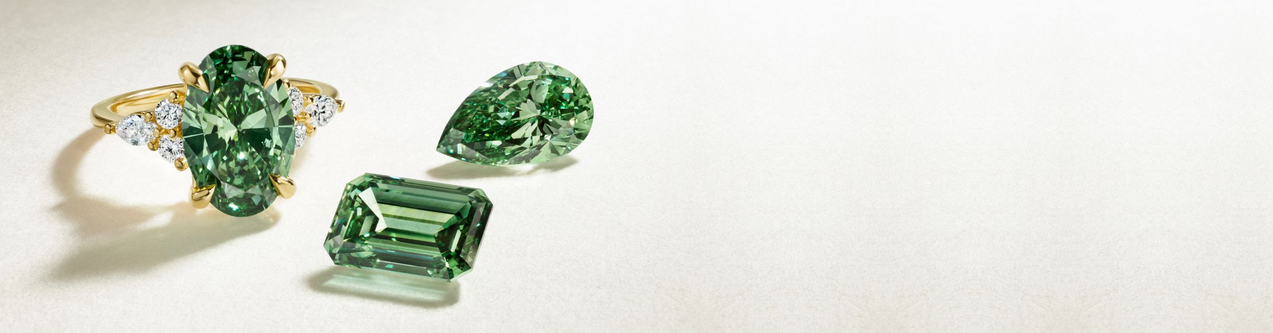 Pacific green lab diamond engagement ring and loose diamonds.