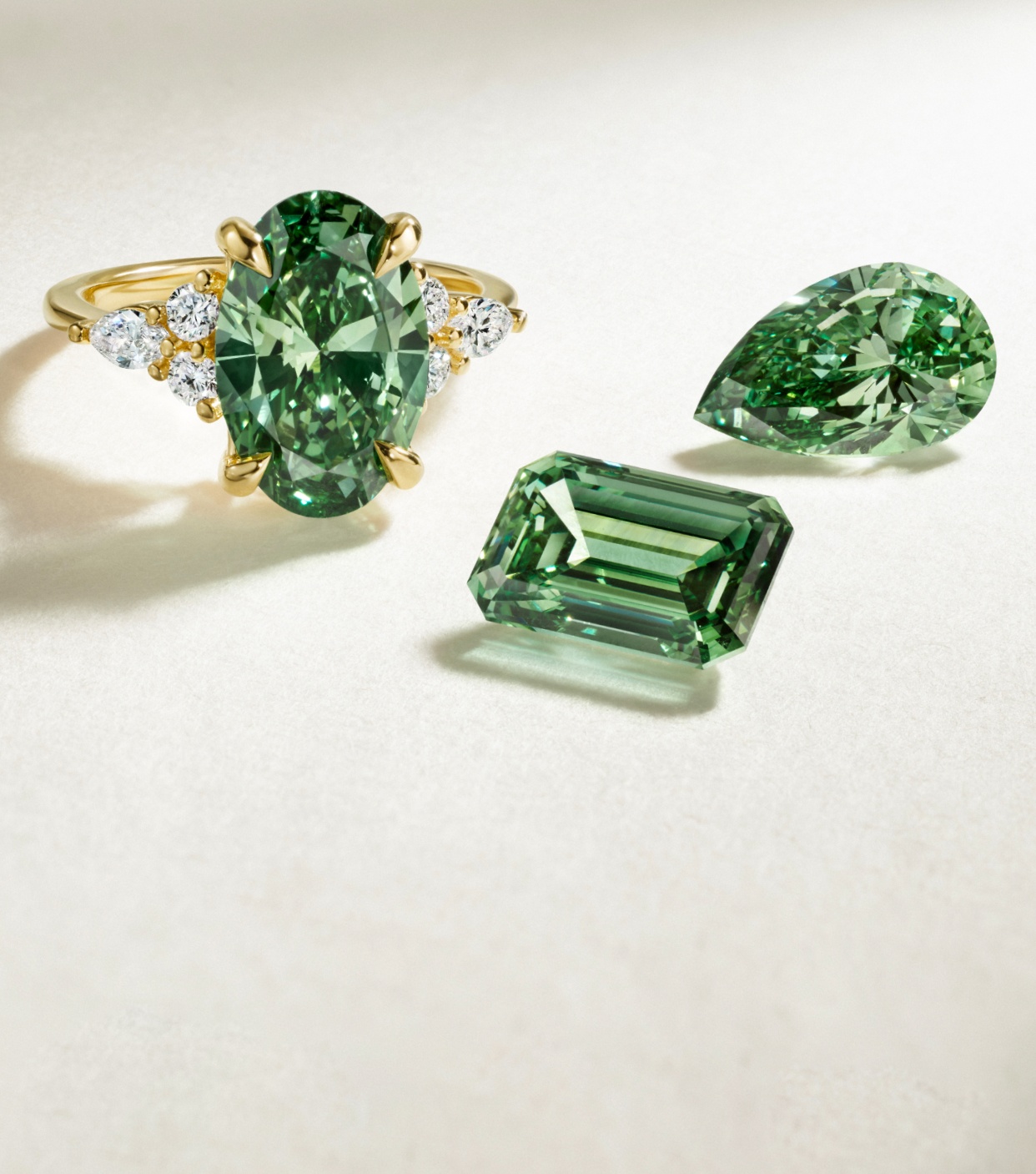 Pacific green lab diamond engagement ring and loose diamonds.