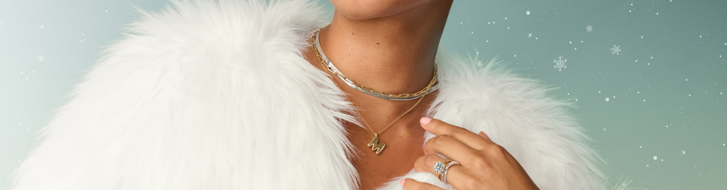 Model wearing chain necklaces and personalized pendant.
