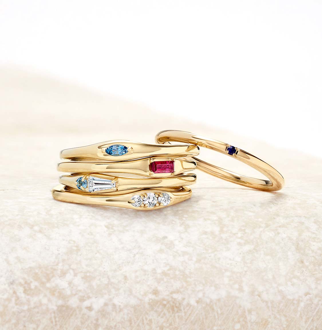 Gold stacked fashion rings.