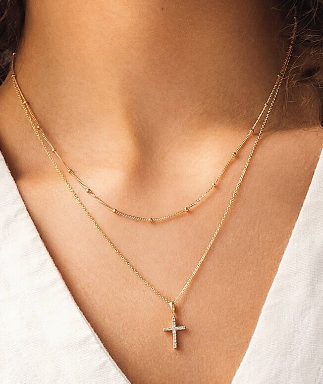 Layered yellow gold cross necklace