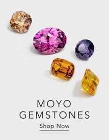 Assortment of loose colored gemstones.