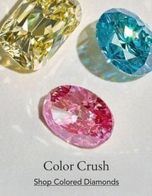 Assortment of colored diamonds.