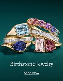 Assortment of gemstone fashion rings representing a variety of birthstones.