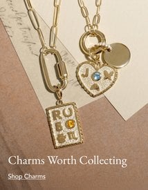 Gold personalizable charms on paperclip necklaces.
