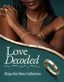Model wearing fine jewelry from the Love Decoded collection.