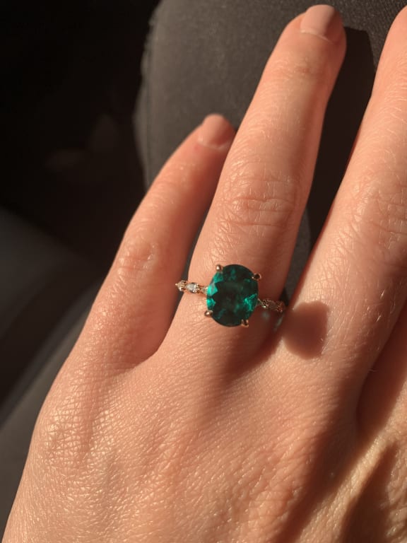 Oval diamond ring on hand