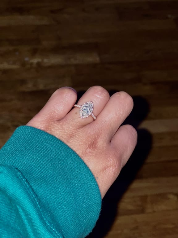Oval diamond ring on hand