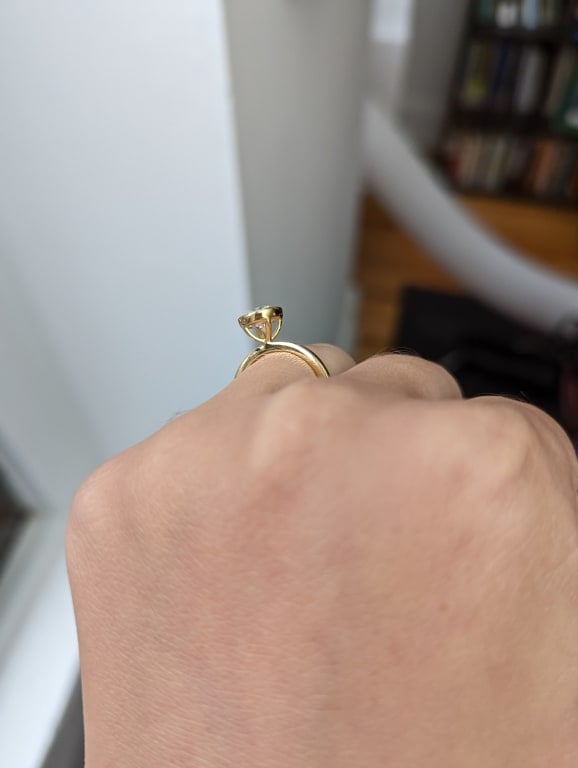 Oval diamond ring on hand