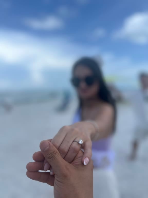 Oval diamond ring on hand