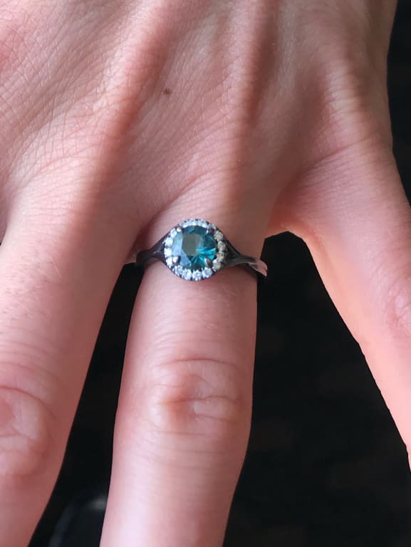 Oval diamond ring on hand