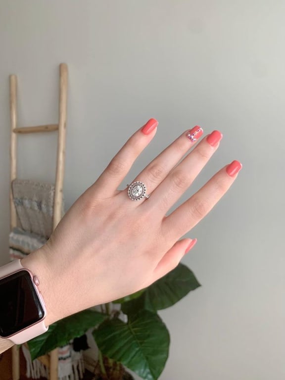 Oval diamond ring on hand