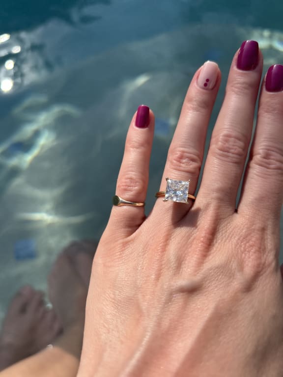 Oval diamond ring on hand