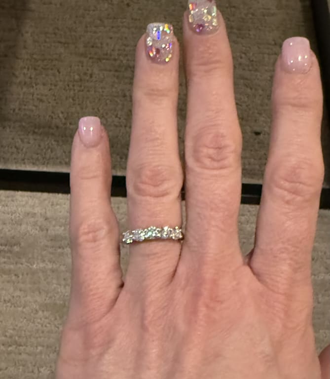 Oval diamond ring on hand