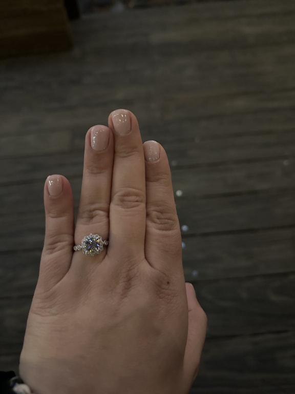 Oval diamond ring on hand