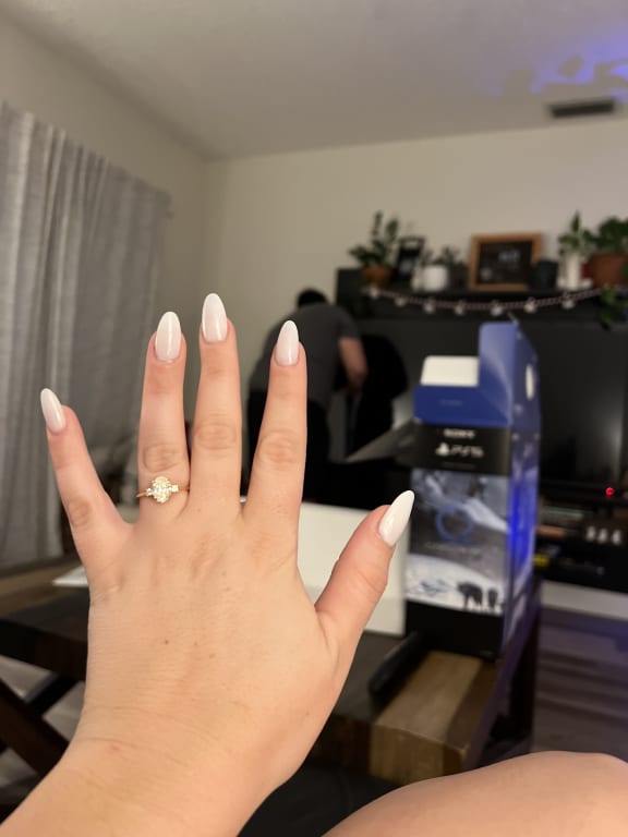 Oval diamond ring on hand