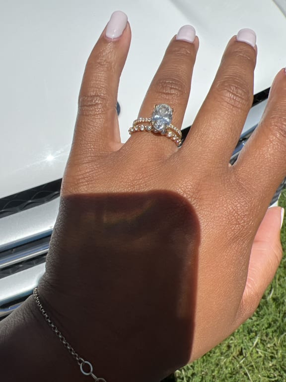 Oval diamond ring on hand