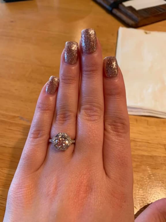 Oval diamond ring on hand
