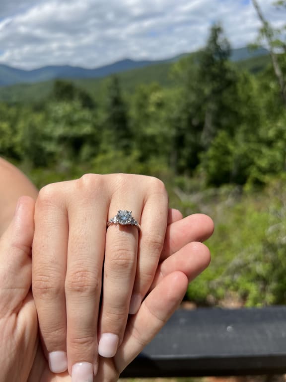 Oval diamond ring on hand