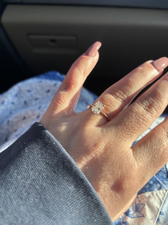Oval diamond ring on hand