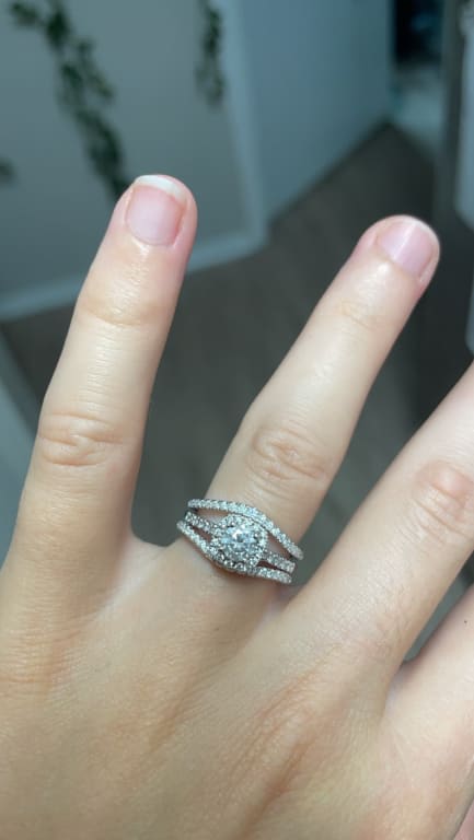 Oval diamond ring on hand
