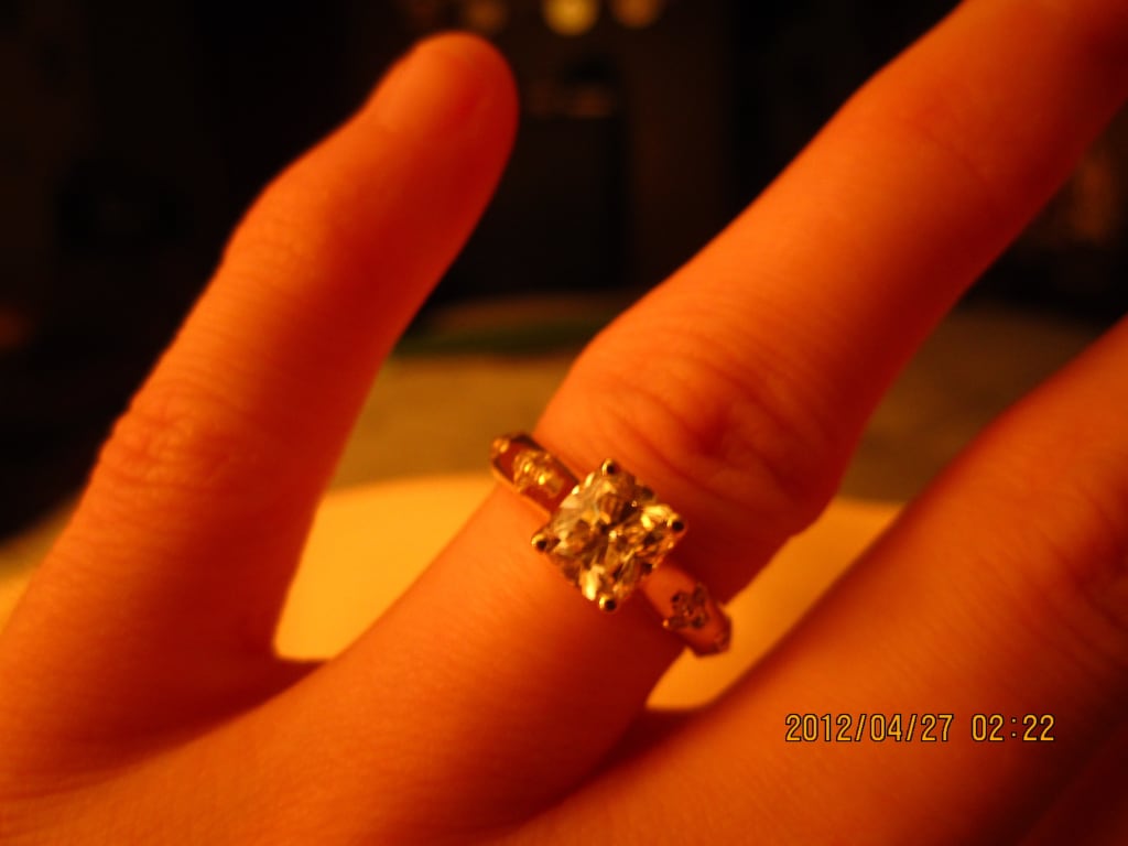 Oval diamond ring on hand