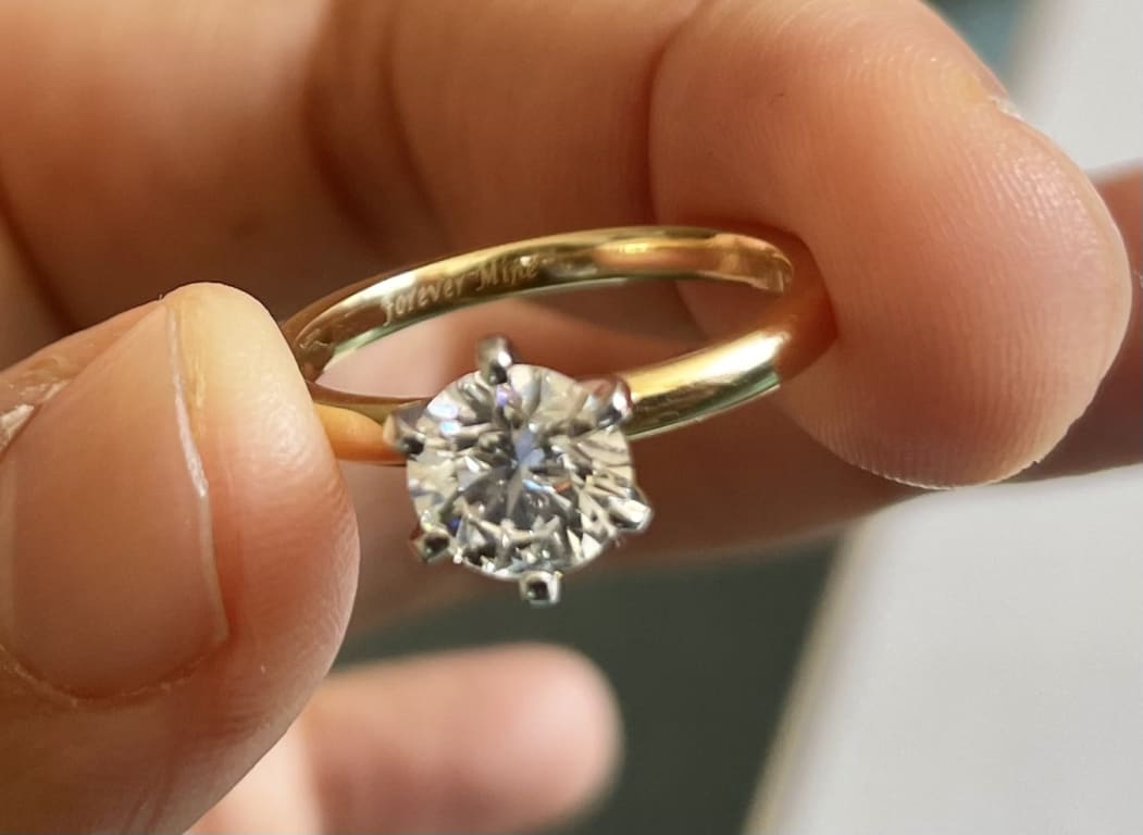 Oval diamond ring on hand