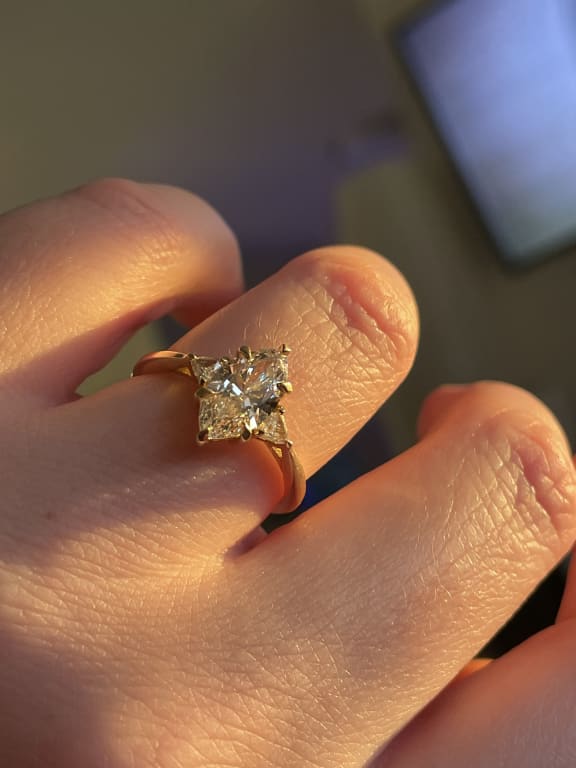 Oval diamond ring on hand