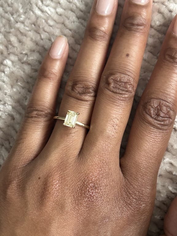 Oval diamond ring on hand