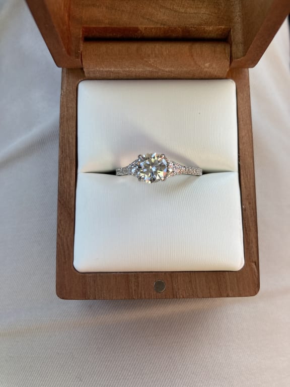 Oval diamond ring on hand