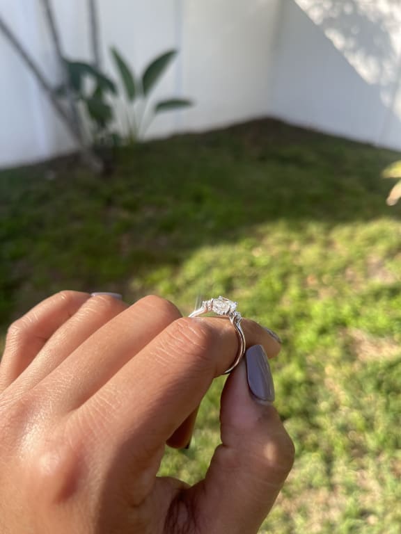 Oval diamond ring on hand