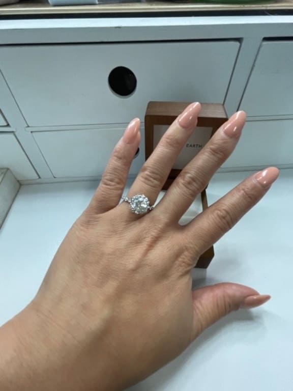 Oval diamond ring on hand