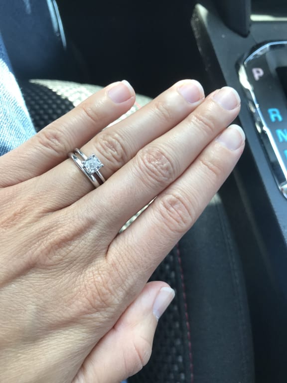 Oval diamond ring on hand