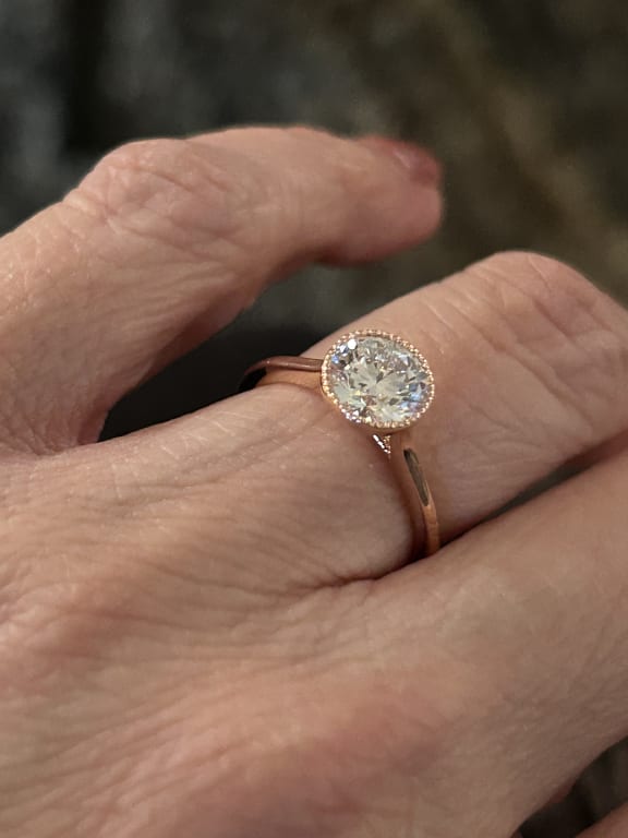 Oval diamond ring on hand