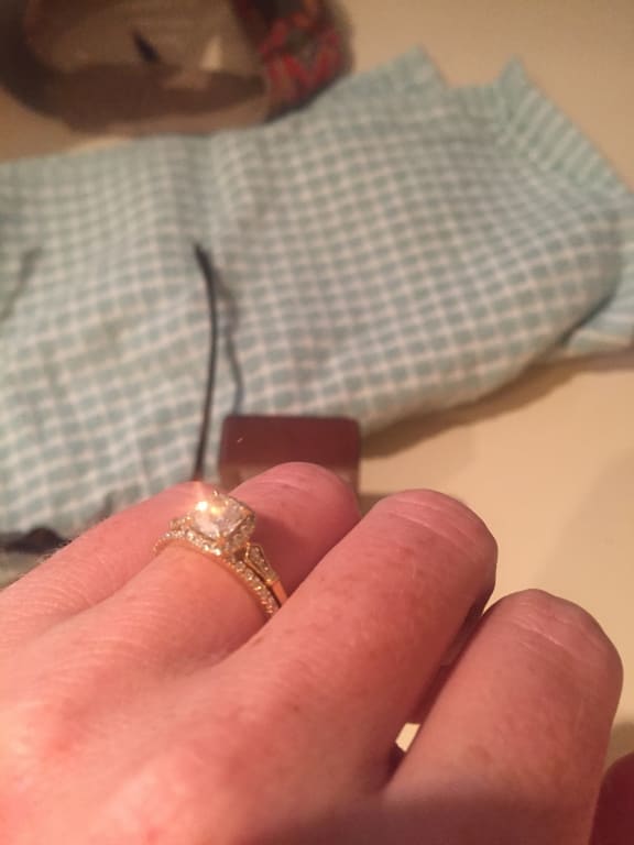 Oval diamond ring on hand