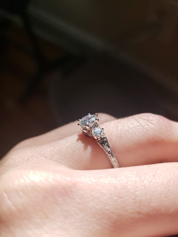 Oval diamond ring on hand