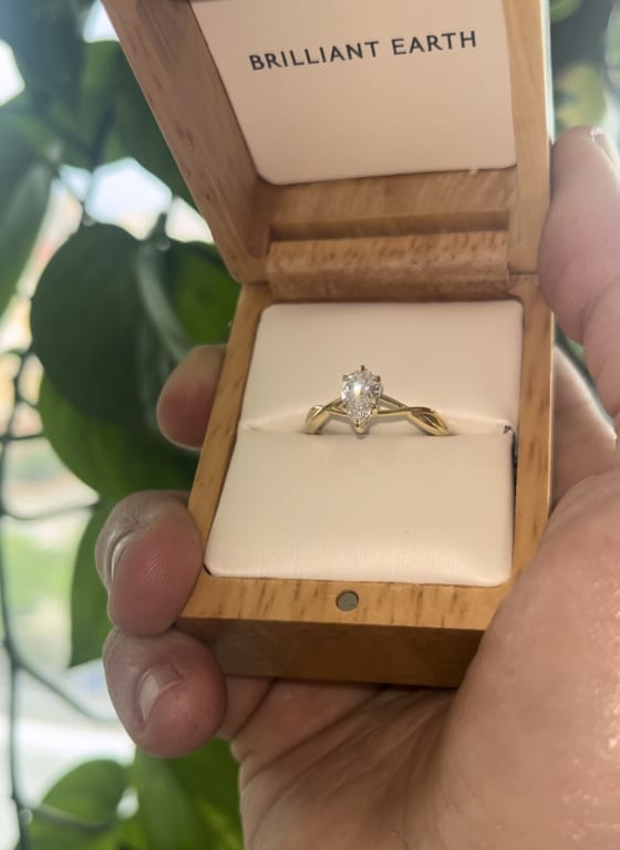 Oval diamond ring on hand