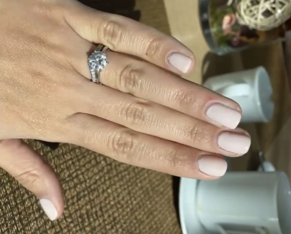 Oval diamond ring on hand