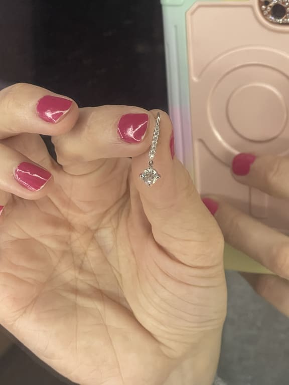 Oval diamond ring on hand