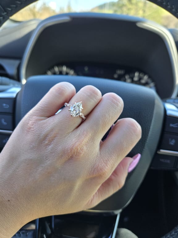 Oval diamond ring on hand